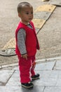 Closeup of young boy in red outside, Guilin, China