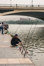 Several men fish from quay along Li River, Guilin, China