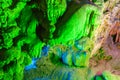 Green and red lighted view in Reed Flute cave, Guilin, China Royalty Free Stock Photo