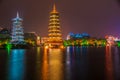 Shanhu Lake at night with pagodas and other buildings, Guilin, China