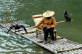 Guilin, China: Woman with Commorants