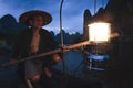 Guilin cormorant fisherman getting ready for night fishing