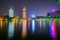 Sun and moon pagodas illuminated at night in Guilin