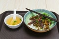 Guilin rice noodles with bowl of soup nearby on a plastic plate Royalty Free Stock Photo