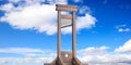 Guillotine against blue sky background. 3d illustration Royalty Free Stock Photo