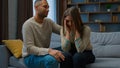 Guilty african american man apologizing to crying woman caring husband boyfriend calm sad stressed wife consoling