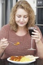 Guilty Woman Eating Takeaway Curry And Drinking Wine Royalty Free Stock Photo