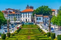 GUIMARAES, PORTUGAL, MAY 22, 2019: View of people passing over jardim do largo da Republica do Brasil square in Portuguese city