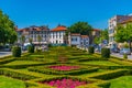 GUIMARAES, PORTUGAL, MAY 22, 2019: View of people passing over jardim do largo da Republica do Brasil square in Portuguese city