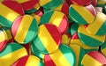 Guinea Badges Background - Pile of Guinean Flag Buttons.