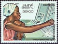 GUINEA-BISSAU - CIRCA 1984: A stamp printed in Guinea-Bissau shows telephonist and switchboard, circa 1984.