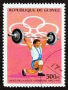 GUINEA - CIRCA 1995: A stamp printed in Guinea from the `Olympic Games, Atlanta 1996` issue shows weightlifting, circa 1995.