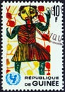 GUINEA - CIRCA 1966: A stamp printed in Guinea shows Child in the garden children drawing, circa 1966.