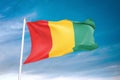 Guinea flag waving sky background 3D illustration Royalty Free Stock Photo