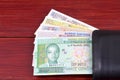 Guinean money in the black wallet