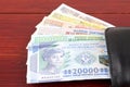 Guinean money in the black wallet