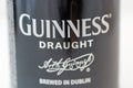 Guiness draught beer can closeup against white