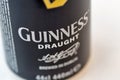 Guiness draught beer can closeup against white