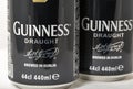 Guiness draught beer cans closeup against white