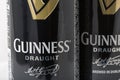 Guiness draught beer cans closeup against white