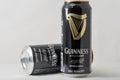 Guiness draught beer cans closeup against white