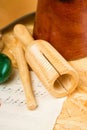 Guiro on wooden board and sheet with music