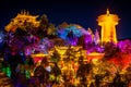 Guishan Dafo Big Buddha temple with the giant Tibetan Buddhist prayer wheel colourfully illuminated at night long exposure shot