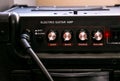 Guitar amplifier with dials and controls for volume, gain, bass, treble