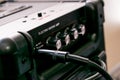 Guitar amplifier with dials and controls for volume, gain, bass, treble. Jack cable connected Royalty Free Stock Photo