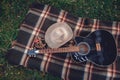 Guitar, basket, sandwiches, plaid and juice in a blossoming garden. Vintage tender background. Romance, love, date