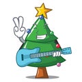 With guitar Christmas tree character cartoon Royalty Free Stock Photo