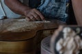 A guitar craftsman are carving a classical guitars made from wood, with Balinese pattern, in a wooden guitar workshop at Guwang