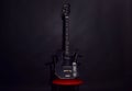 Guitar in deep black color on black background Royalty Free Stock Photo