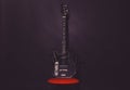Guitar in deep black color on black background Royalty Free Stock Photo