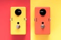 Guitar effect pedals on colorful background.