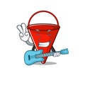 With guitar fire bucket cartoon in the yard Royalty Free Stock Photo