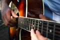 Guitar in the hands of a guitarist. Man plays the guitar. Spanish guitar. Guitar strings Royalty Free Stock Photo