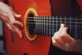 Guitar in the hands. Plays guitar. Guitar Strings. Guitar in vintage style