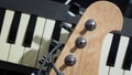 Guitar head and keyboard piano keys. Music, composer, group band concept Royalty Free Stock Photo