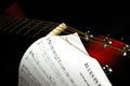 Guitar headstock with a blues sheet music Royalty Free Stock Photo