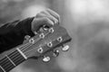 Guitar headstock detail with tuning hand