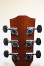 Guitar headstock and tuning pegs on isolated background. Royalty Free Stock Photo