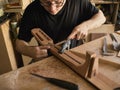 The guitar master makes guitar neck.