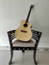 a guitar and a matching pair chair accompany the break