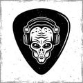 Guitar mediator with alien head in headphones