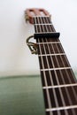 Guitar neck with capo low angle view close up Royalty Free Stock Photo