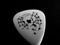 Guitar pick on the dark backround Royalty Free Stock Photo