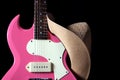 Guitar Pink Hat Isolated on Black Royalty Free Stock Photo