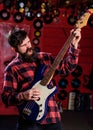 Guitar player concept. Musician with beard play electric guitar Royalty Free Stock Photo