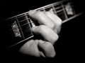 Guitar player fretboard playing chords black Royalty Free Stock Photo